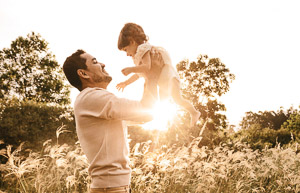 A father with his young son in his arms