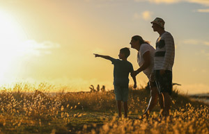 A family at sunset.